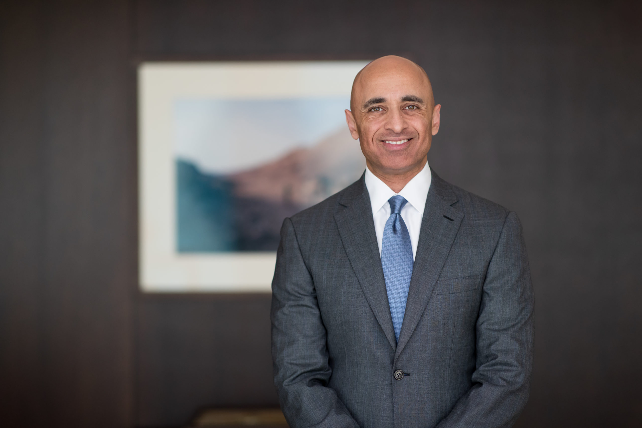 A headshot of UAE Ambassador to the US, Yousef Al Otaiba, smiling.