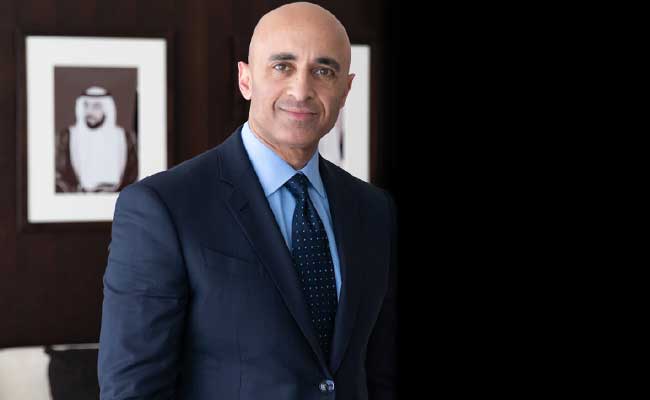 A headshot of UAE Ambassador to the US, Yousef Al Otaiba, taken in his office.
