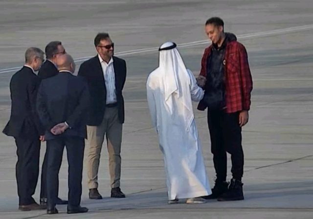 Yousef Al Otaiba greets Britney Griner on the UAE air base tarmac.