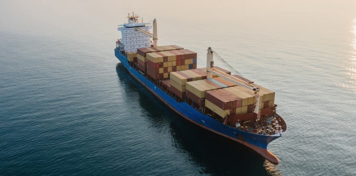 A large cargo ship holds shipping containers.