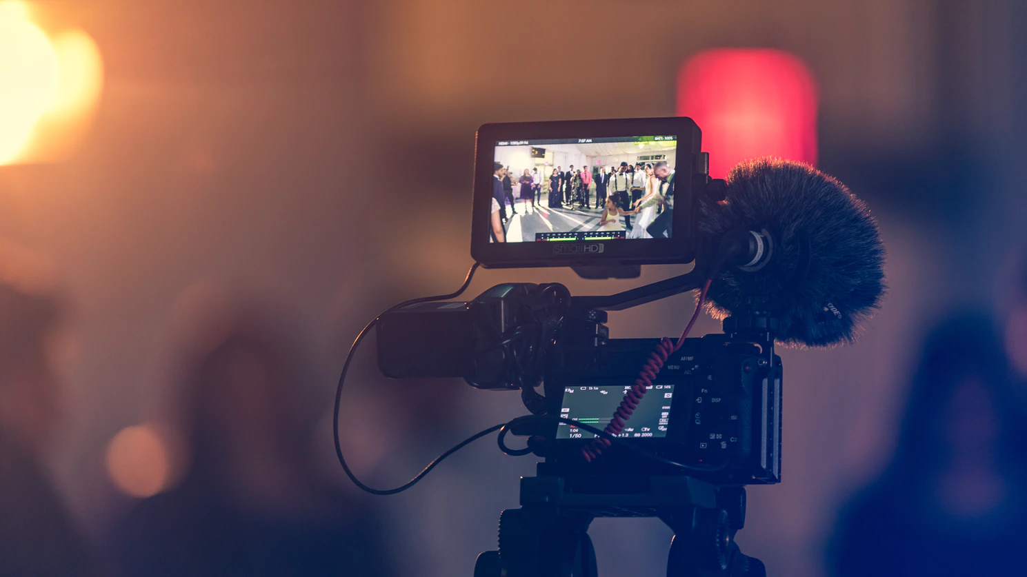 Image of a camera recording an event.