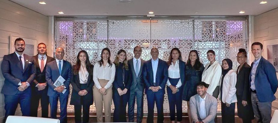Ambassador Yousef Al Otaiba stands with Emirates Leadership fellows at the Harvard Kennedy School.