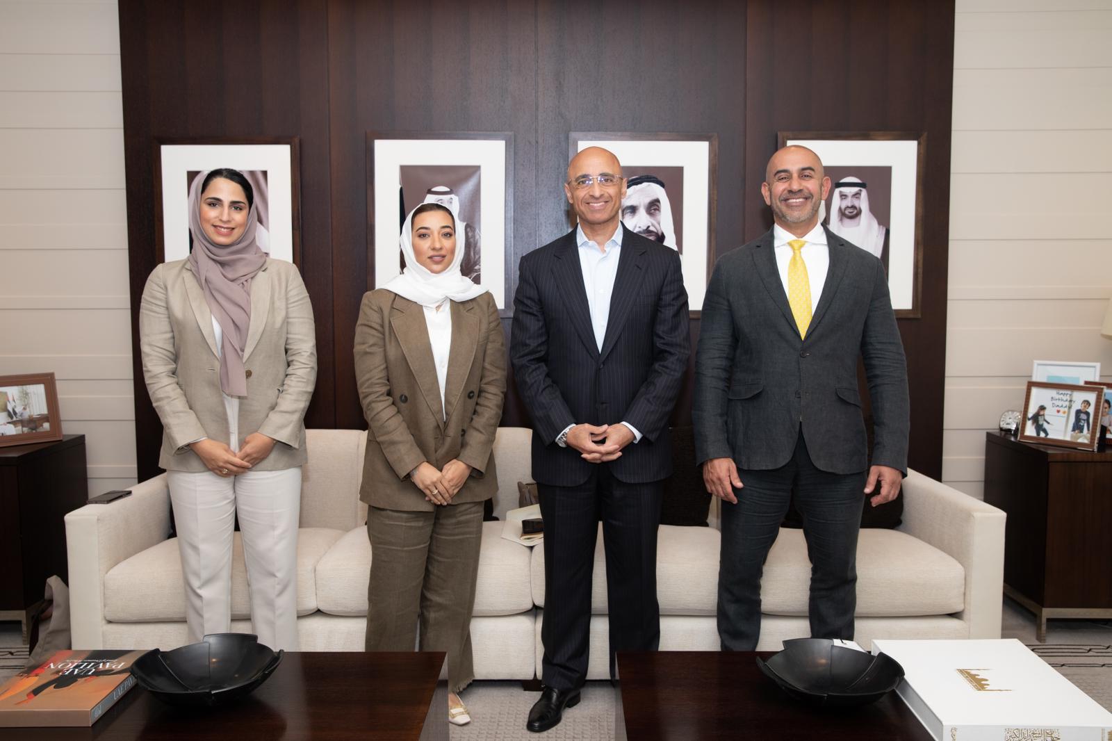 Yousef Al Otaiba stands with leaders of a UAE delegation while meeting at the UAE Embassy in Washington, D.C.
