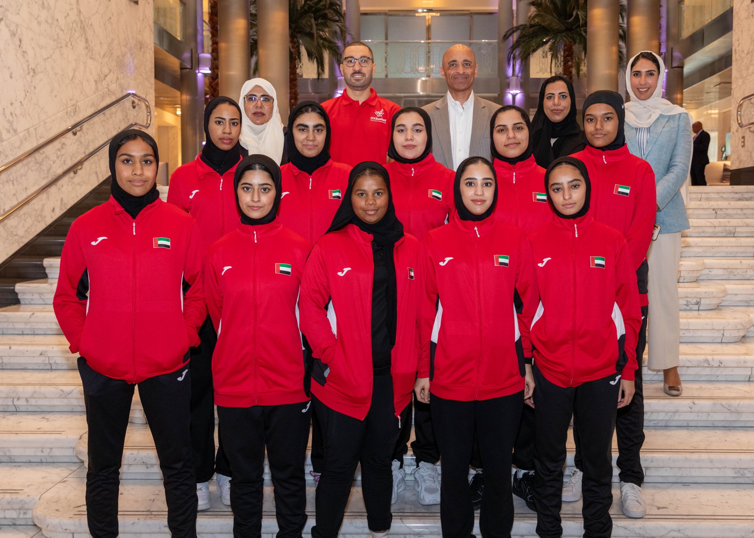 Ambassador Yousef Al Otaiba stands with players from the UAE’s U-19 Women’s National basketball team.